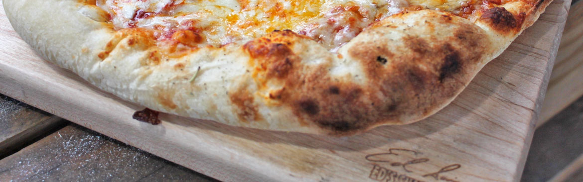 Pizza on Ed's Shape Shack cutting board